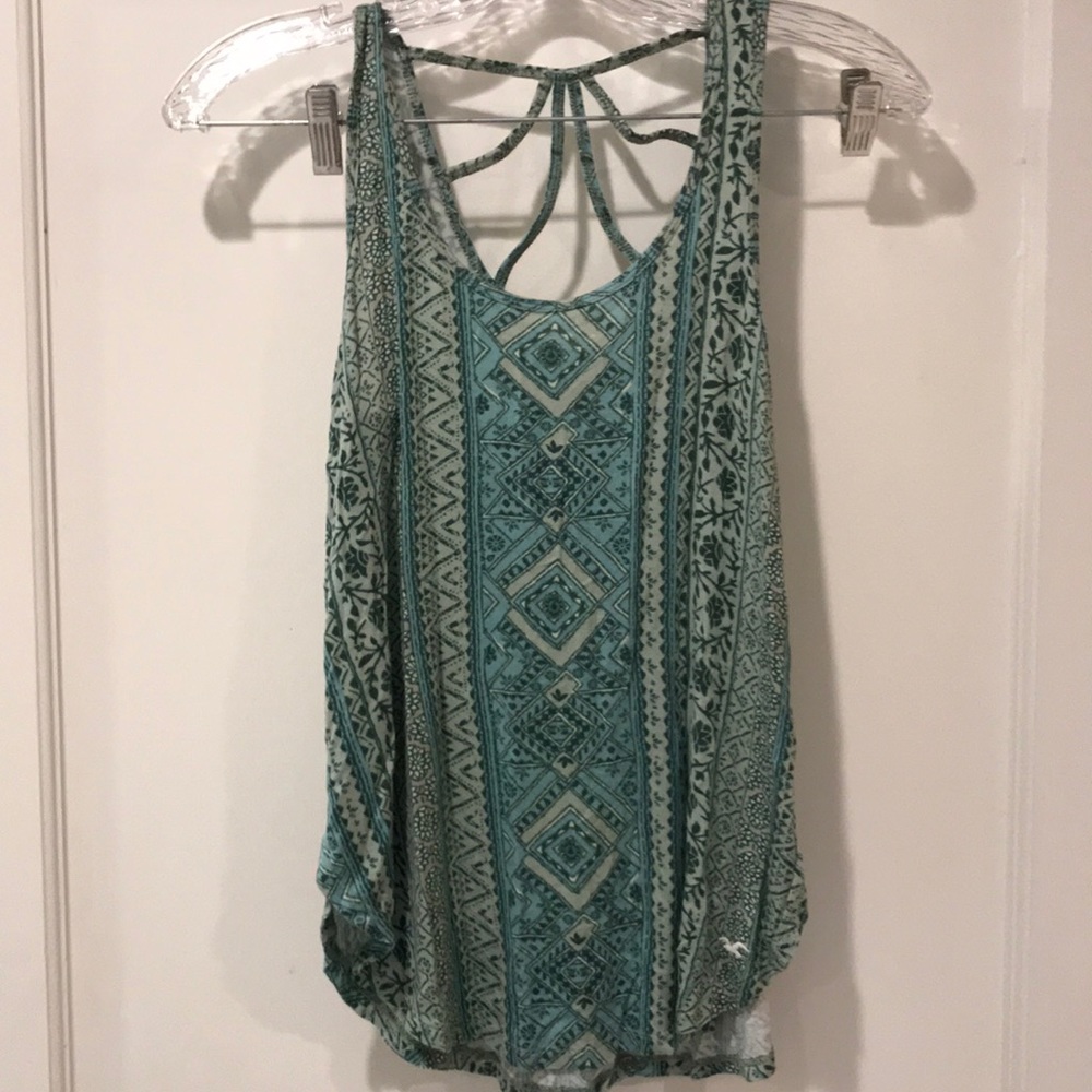 Blue & green sleeveless blouse.